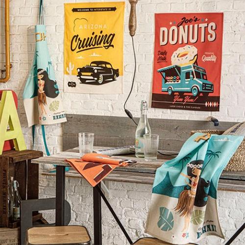 Joe's Donuts Tea Towel by MISTERATOMIC